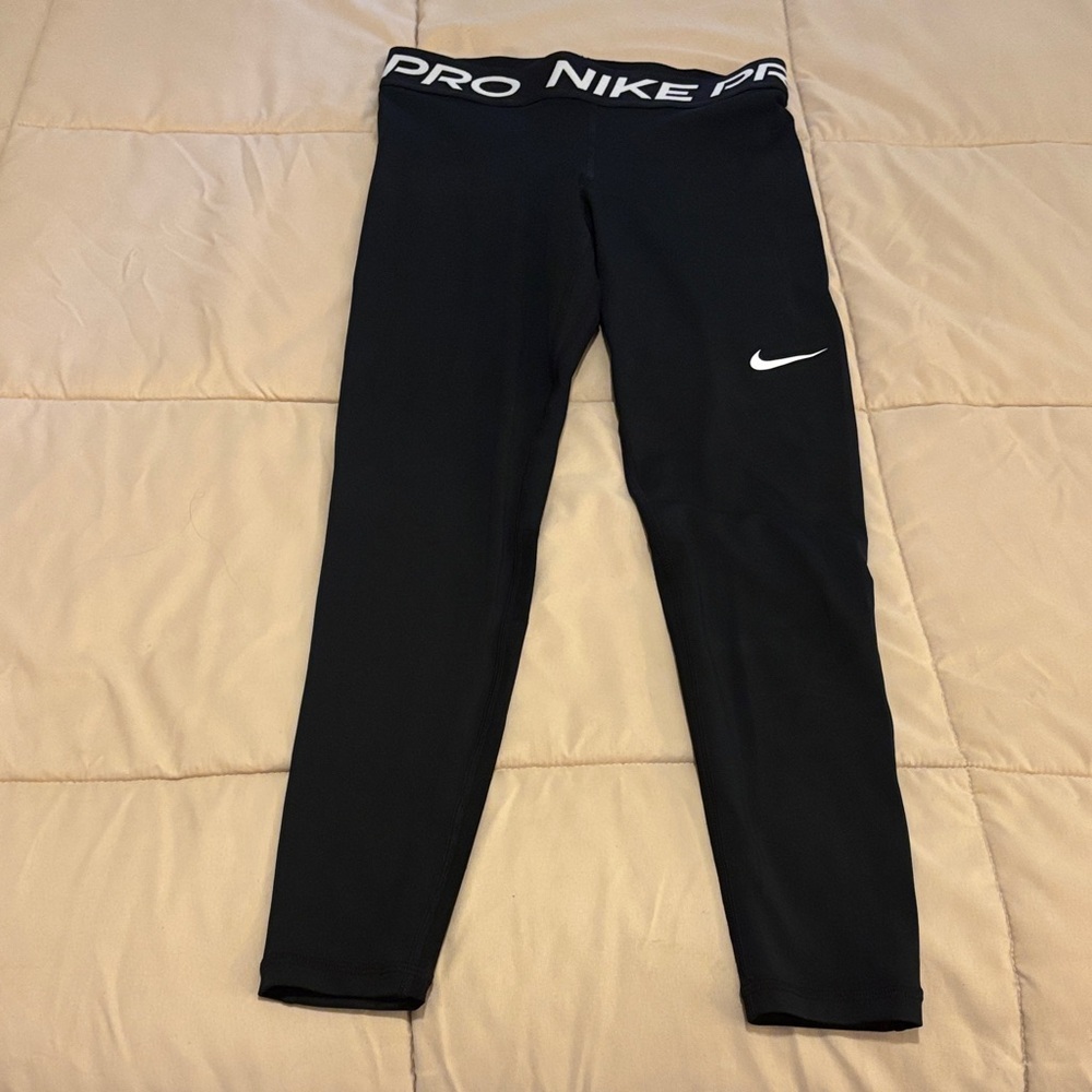 Women’s Nike Pro Black Leggings with White Logo.